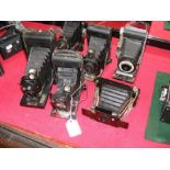 Six assorted vintage cameras including Ensignette