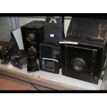 Various vintage cameras including a half plate cam