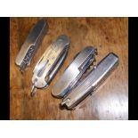Four vintage penknives, including the Currey Locks