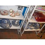 Four shelves of ceramic and glassware