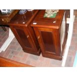 A pair of mahogany bedside cabinets with single do