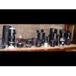 A large selection of vintage camera lenses