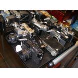 A tray of vintage cameras including Zenit