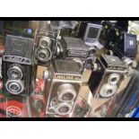 Seven assorted vintage cameras including Halina an