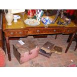 A mahogany breakfront desk with inset leather top