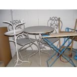 A child's garden set of table and two chairs, thre