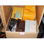 A box of assorted vintage cameras and photographic