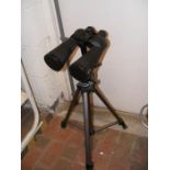 A pair of field binoculars on adjustable tripod