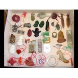A selection of carved jade pendants and other