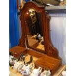 A large dressing table mirror