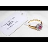 A ruby and diamond ring in 18ct setting