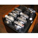 A tray of vintage cameras including two folding ca