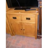 A light oak utility cupboard - width 75cms