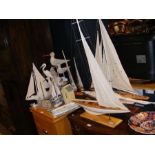 Assorted maritime ornaments, including racing yach