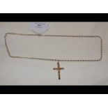 A gold cross on chain