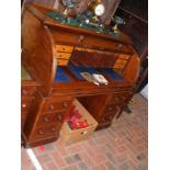A Victorian cylinder pedestal desk with pull out w