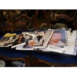 A tray of celebrity signed paraphernalia including