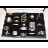 A box of assorted silver and other rings