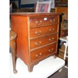 A small mahogany chest of four graduated drawers