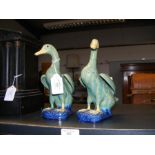 A pair of Oriental ceramic ducks - with mark to ba