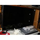 A SHARP 40" LCD Colour TV - model LC-40UI7552K - together with DVD player and remotes