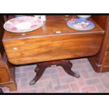 A 19th century mahogany Pembroke table on centre c