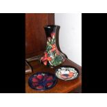 Three pieces of Moorcroft ceramics - vase and two