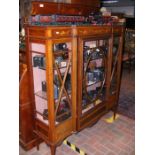 A late Victorian inlaid mahogany breakfront displa