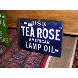 A vintage enamel sign with blue ground - 'Use Tea Rose