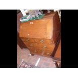 A Georgian oak bureau with fitted interior and dra