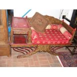 A Chinese red lacquered hall seat with table besid