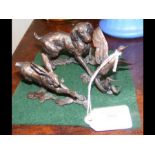 A bronze figure of dog chasing bird, together with