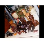 A collection of assorted wooden animals, including