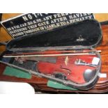 An antique violin bearing label 'Celebre Vosgien'