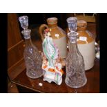 A pair of glass decanters, together with two Colen