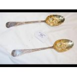 A pair of London hallmarked silver berry spoons