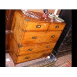 A 19th century teak military chest with brass corn