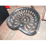 A vintage cast metal tractor seat by Amouroux Toul