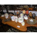 A medley of decorative eggs and floral ornaments,