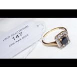 A sapphire and diamond ring in 18ct setting - the