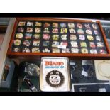 A display case of Beano collectors pins