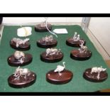 Ten white metal 'animal' place card holders