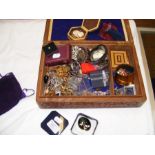 A box of costume jewellery including watches, bang