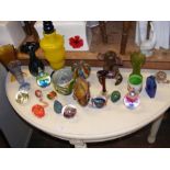 A medley of coloured glass vases and figures, incl