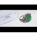 A jade and diamond ring in white gold setting