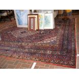 A Persian carpet with geometric border and