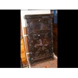 A Victorian carved oak hall wardrobe with lions fa
