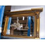 A decorative antique style overmantel mirror with