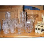 A cluster of cut glass vases