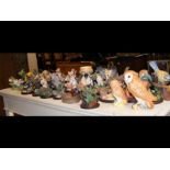 A collection of country bird sculpted ornaments, e